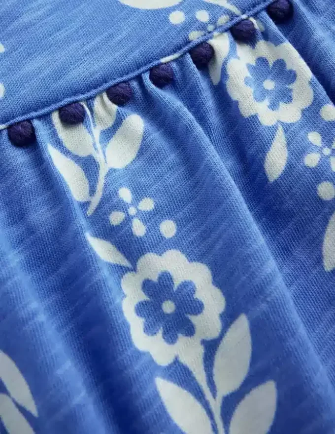 Ciara Pom Trim Jersey Romper Blue Floral Ciara Pom Trim Jersey Romper Blue Floral