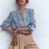 Embroidered Trim Interest Top Chambray Embroidered Trim Interest Top Chambray