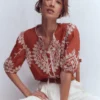 Leah Short Sleeve Interest Top Red Floral Embroidery Leah Short Sleeve Interest Top Red Floral Embroidery